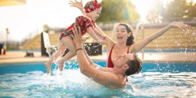 family-enjoying-in-swimming-pool