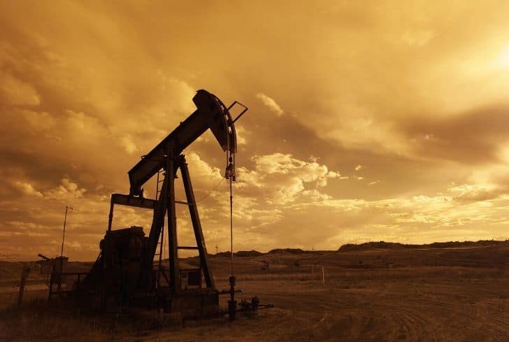 oil-extraction-pump-jack-sunset-clouds