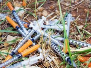 photo-narcotic-syringe-on-the-grass