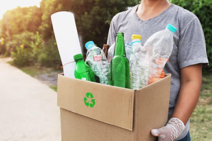 woman hand holdging box garbage for recycle