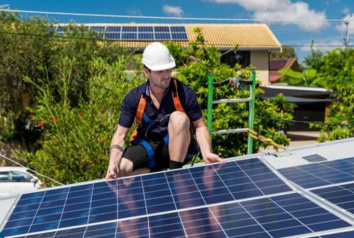 engineer-installing-solar-panels
