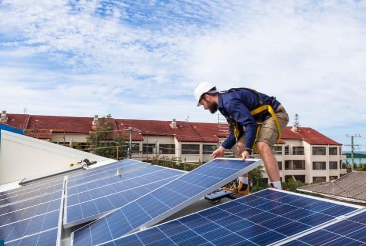 technician-installing-solar-panels