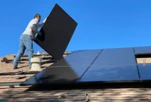 man-installing-solar-panels