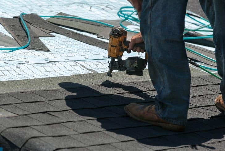 worker-installing-roof-shingles