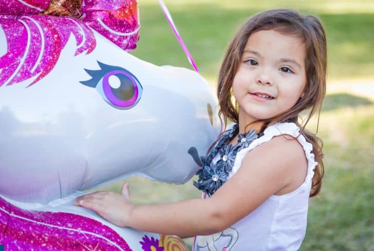 baby-girl-holding-mylar-balloon