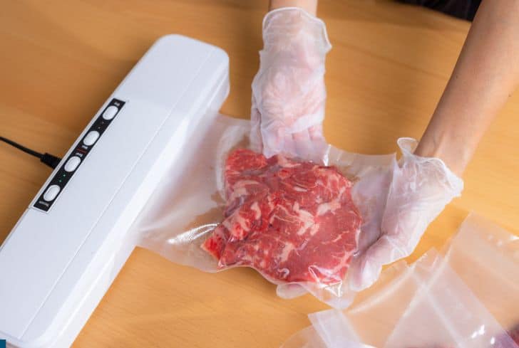 raw-meat-getting-sealed-in-shrink-wrap