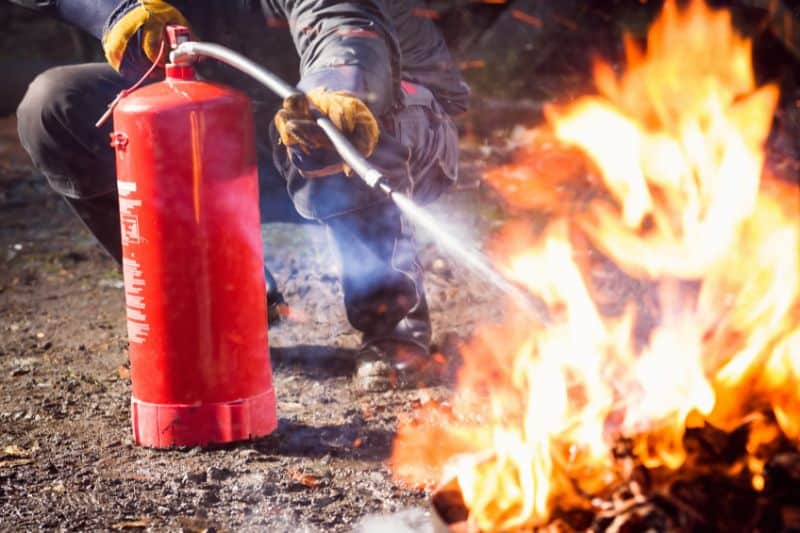 man-using-fire-extinguisher