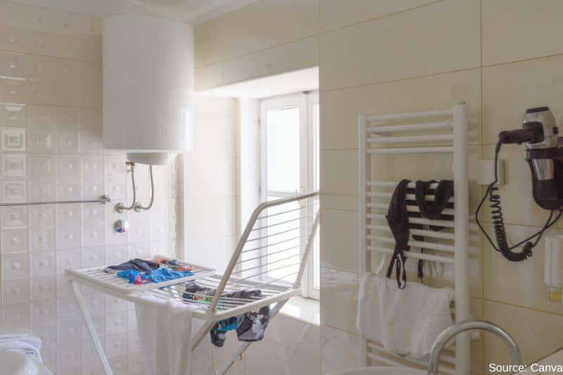 clothes-drying-in-cluttered-bathroom